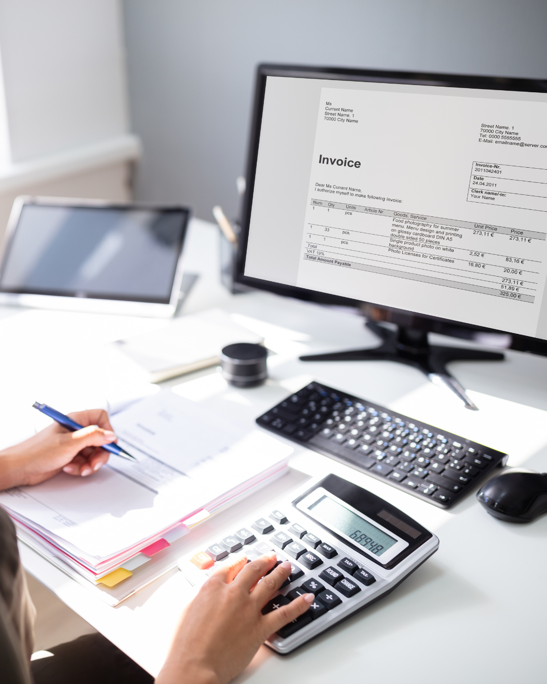 Small business owner reviewing bookkeeping records